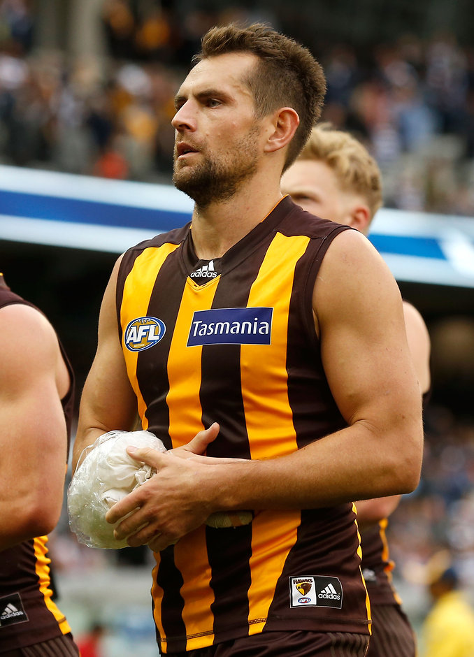 AFL 2016 Rd 01 - Geelong v Hawthorn Luke Hodge walks from the field with his right arm iced up after the loss to Geelong - ${keywords}